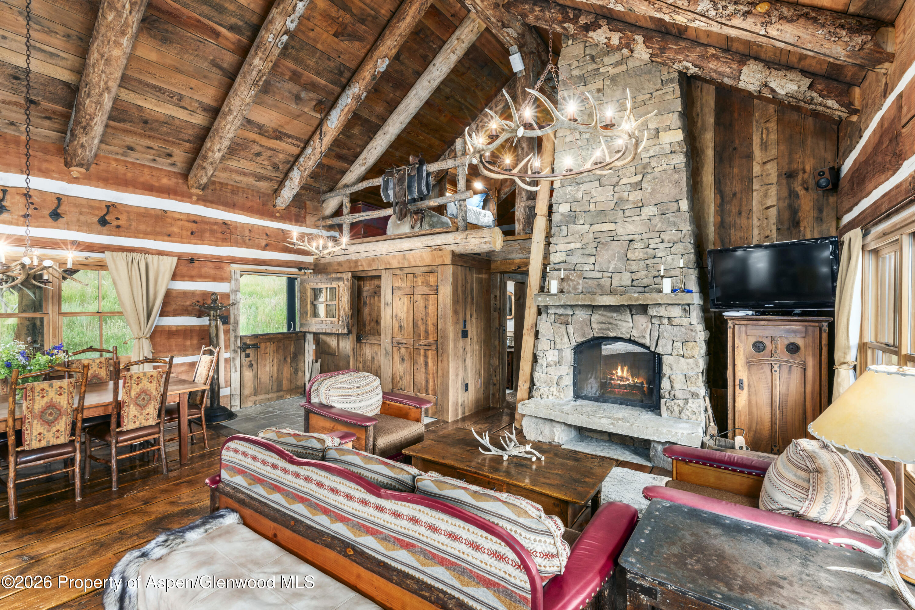 1350 Old Herron Road Basalt, CO 81621 - Photo 17 of 81 a living room with furniture a flat screen tv and a fireplace