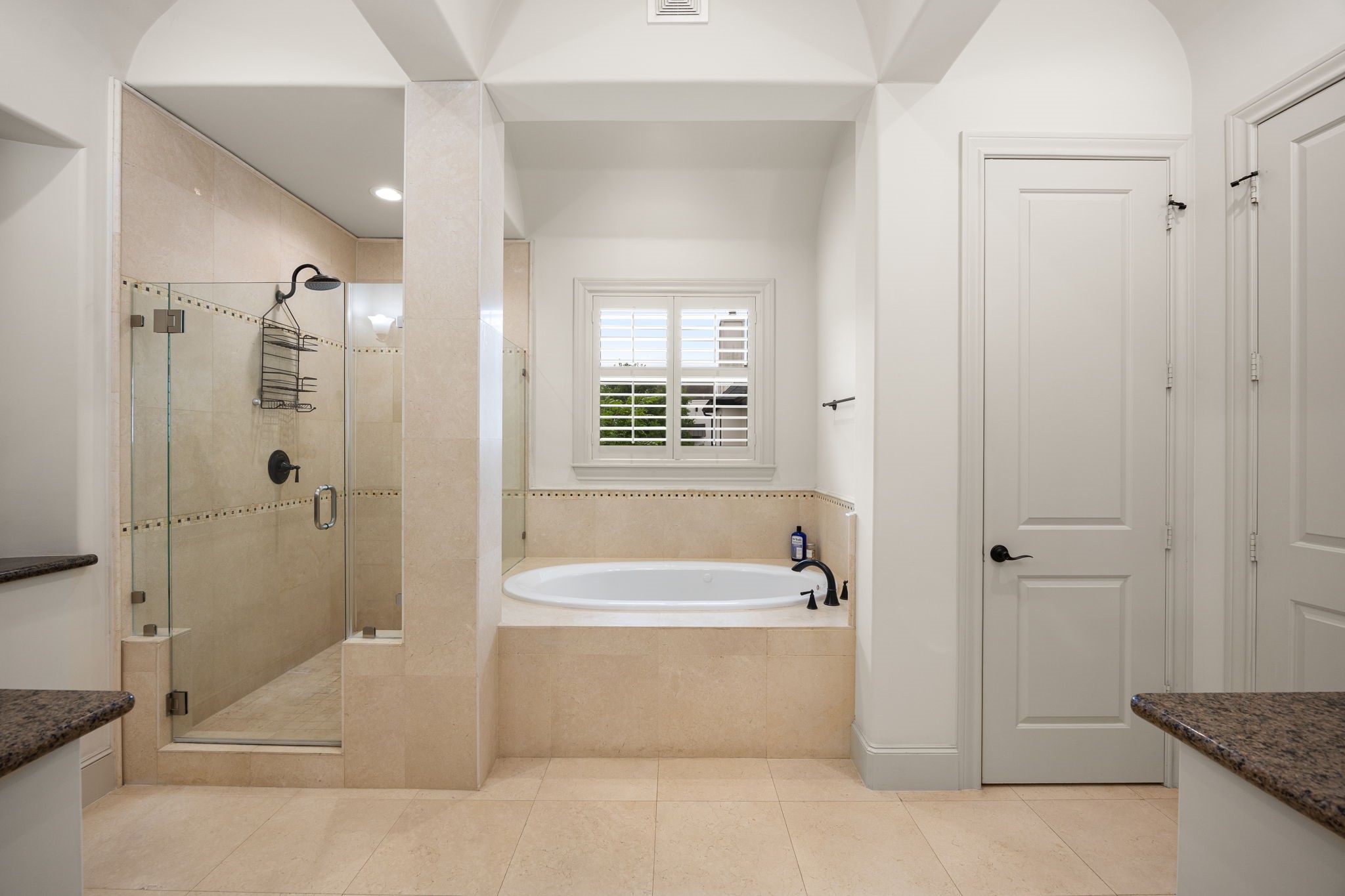 310 West Bell Street Houston, TX 77019 - Photo 33 of 44 The primary bathroom has dual vanities and a water jetted bath tub.