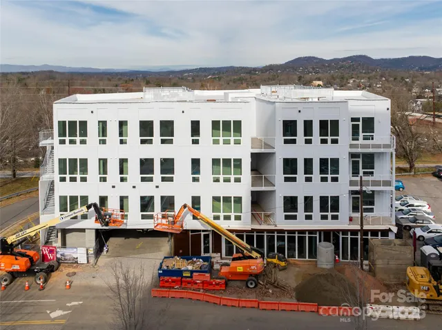 a front view of a building with street view
