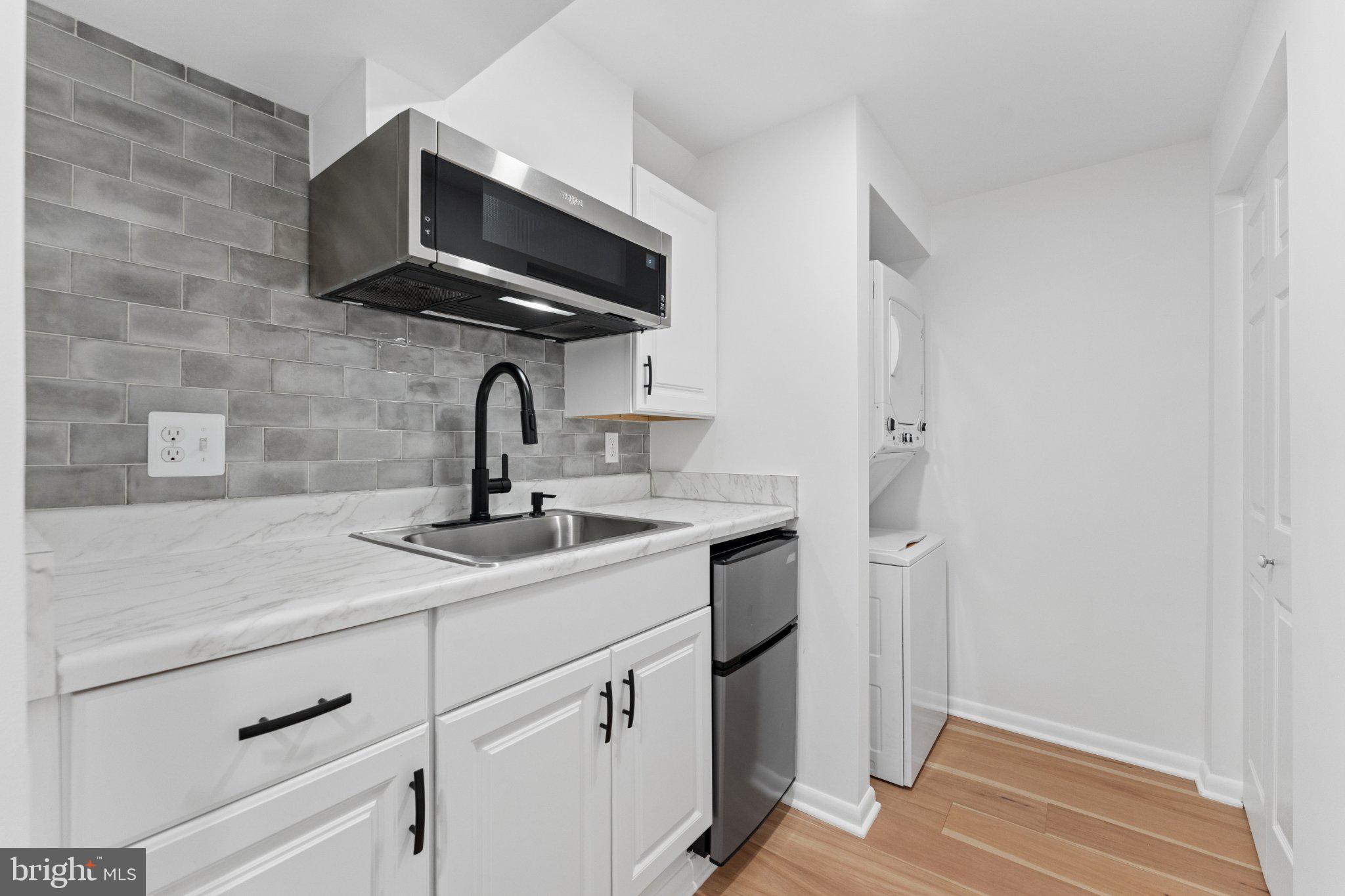 3219 Fox Mill Road Oakton, VA 22124 - Photo 58 of 87 Sleek kitchen with modern finishes.
