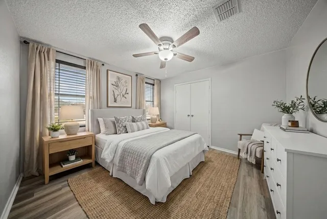 a bedroom with a bed and a table