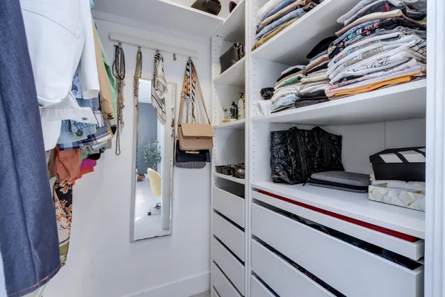 a view of a house with swimming pool and sitting area