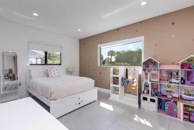 a view of a dining room with furniture and a chandelier