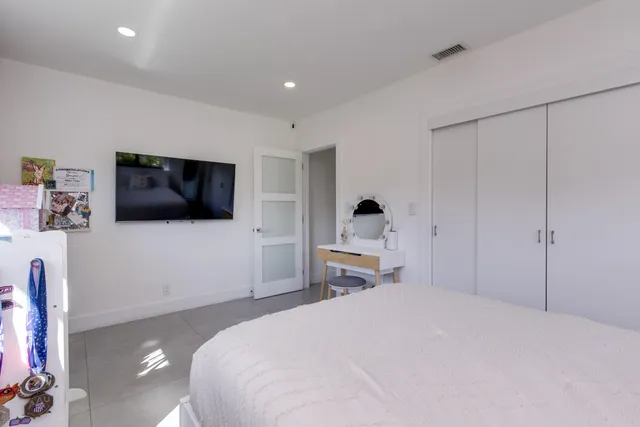 a view of a house with a swimming pool and a chairs
