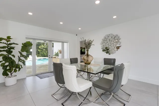 a kitchen with counter top space and living room
