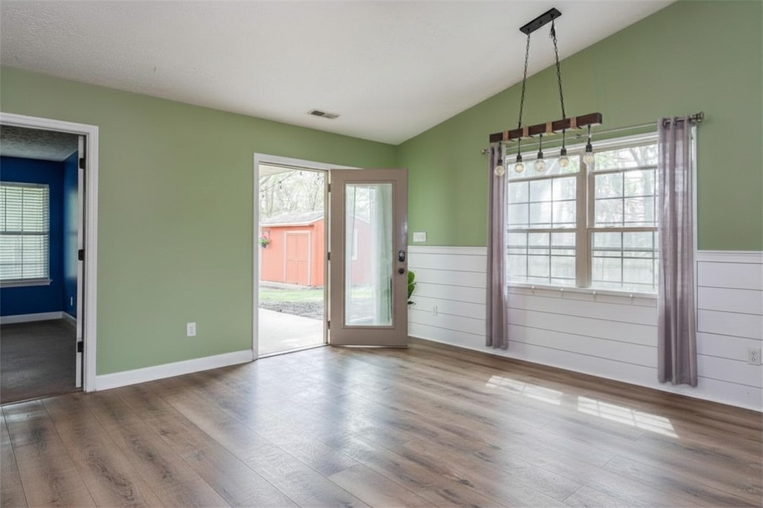 175 Marrett Farm Road Englewood, OH 45322 - Photo 16 of 29 This airy space features wood-style flooring and a charming light fixture, perfect for welcoming guests.