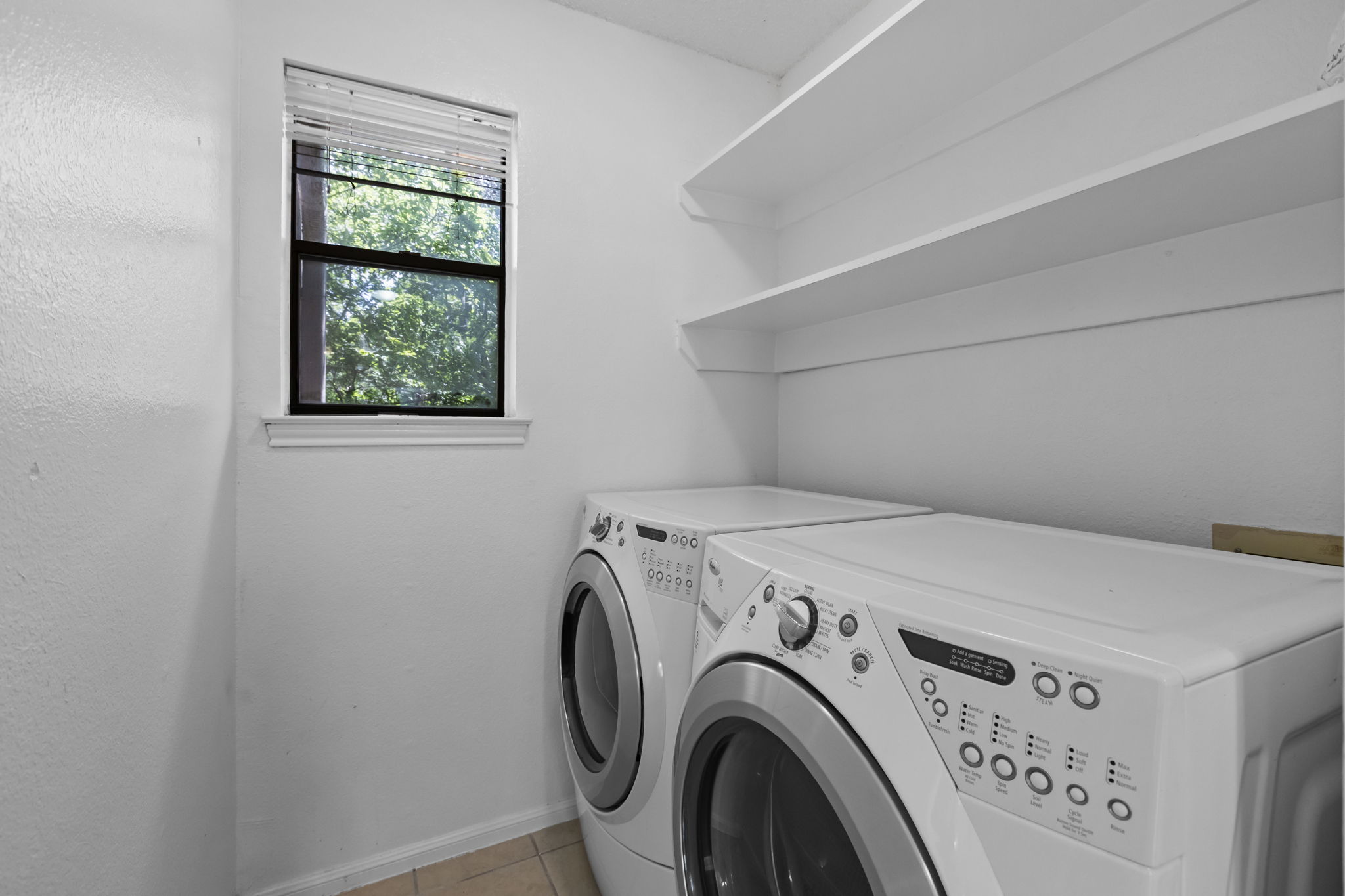 3845 Ranch Road 2222, Unit 26/M2 Austin, TX 78731 - Photo 13 of 21 Laundry room on the main level next to the kitchen