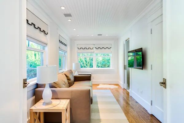 a bathroom with a sink mirror and shower