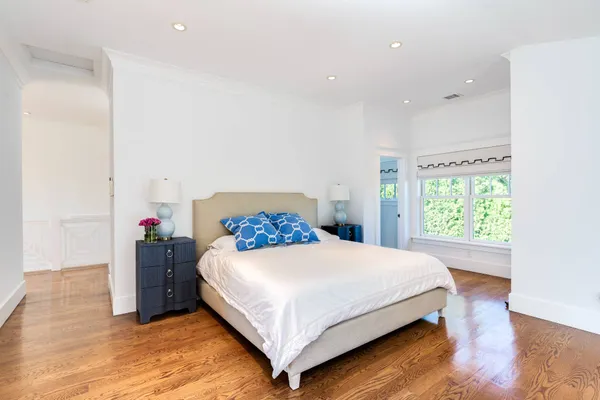 a view of a house with sitting area and garden