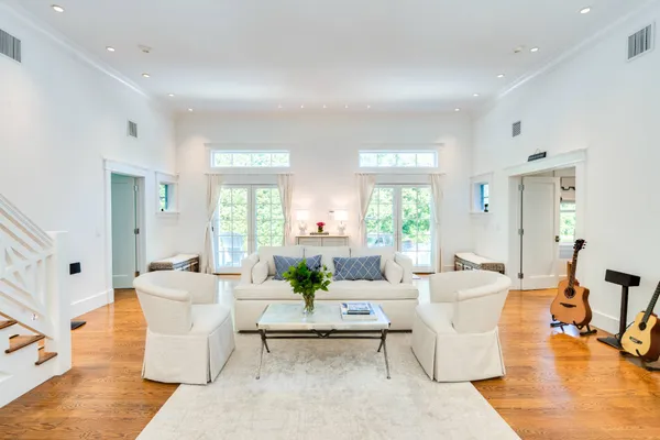 a living room with fireplace furniture and a table