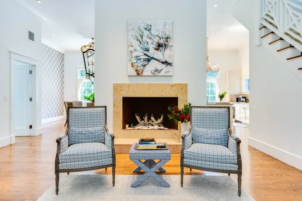a living room with furniture and a fireplace