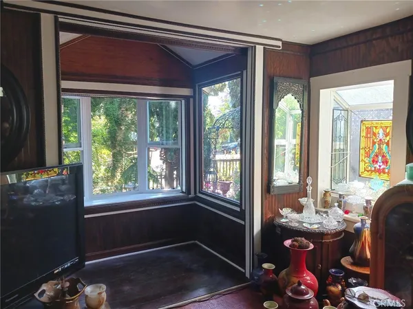 a view of empty room with large windows