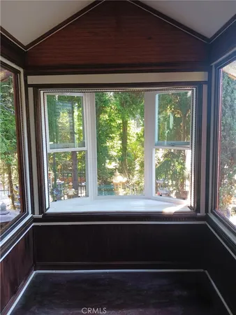 a view of a room that has a large window