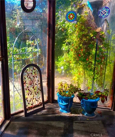 a bathroom with a sink toilet and window