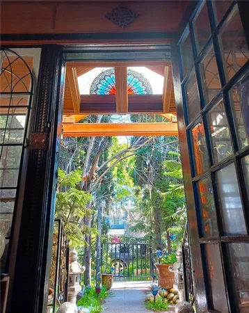 a front view of a multi story residential apartment building with yard