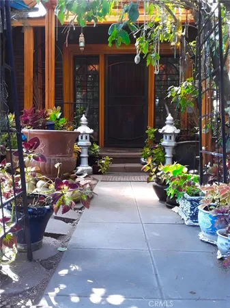 a front view of a house with porch and outdoor seating