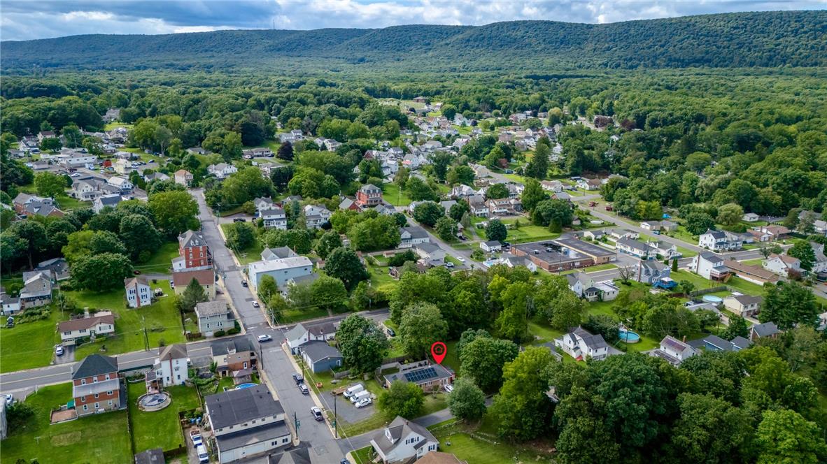 402 Maple Street Roseto, PA 18013 - Photo 39 of 39 Lush green hills and a quiet neighborhood surround this property viewed from above.