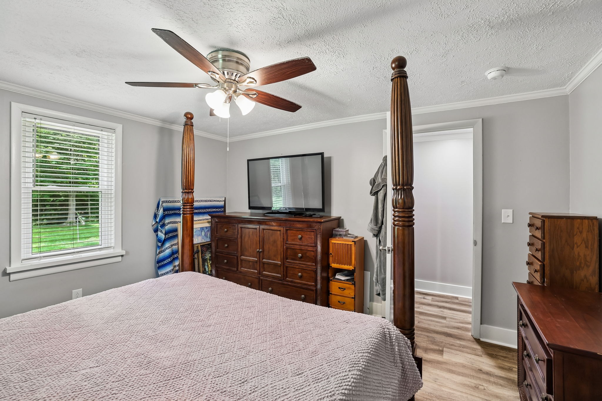 1466 Bible Crossing Road Winchester, TN 37398 - Photo 26 of 42 a bedroom with a bed and a flat tv screen on dresser