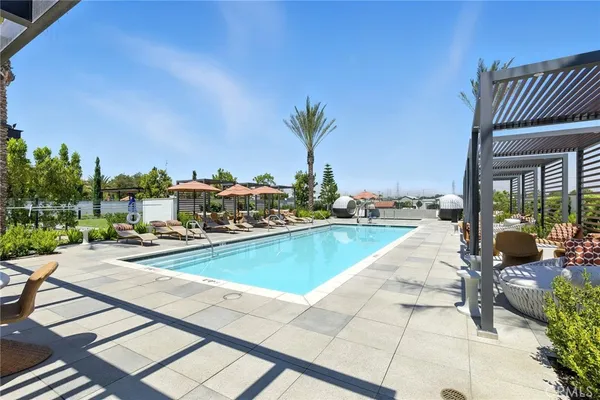 a view of swimming pool with outdoor seating and a terrace