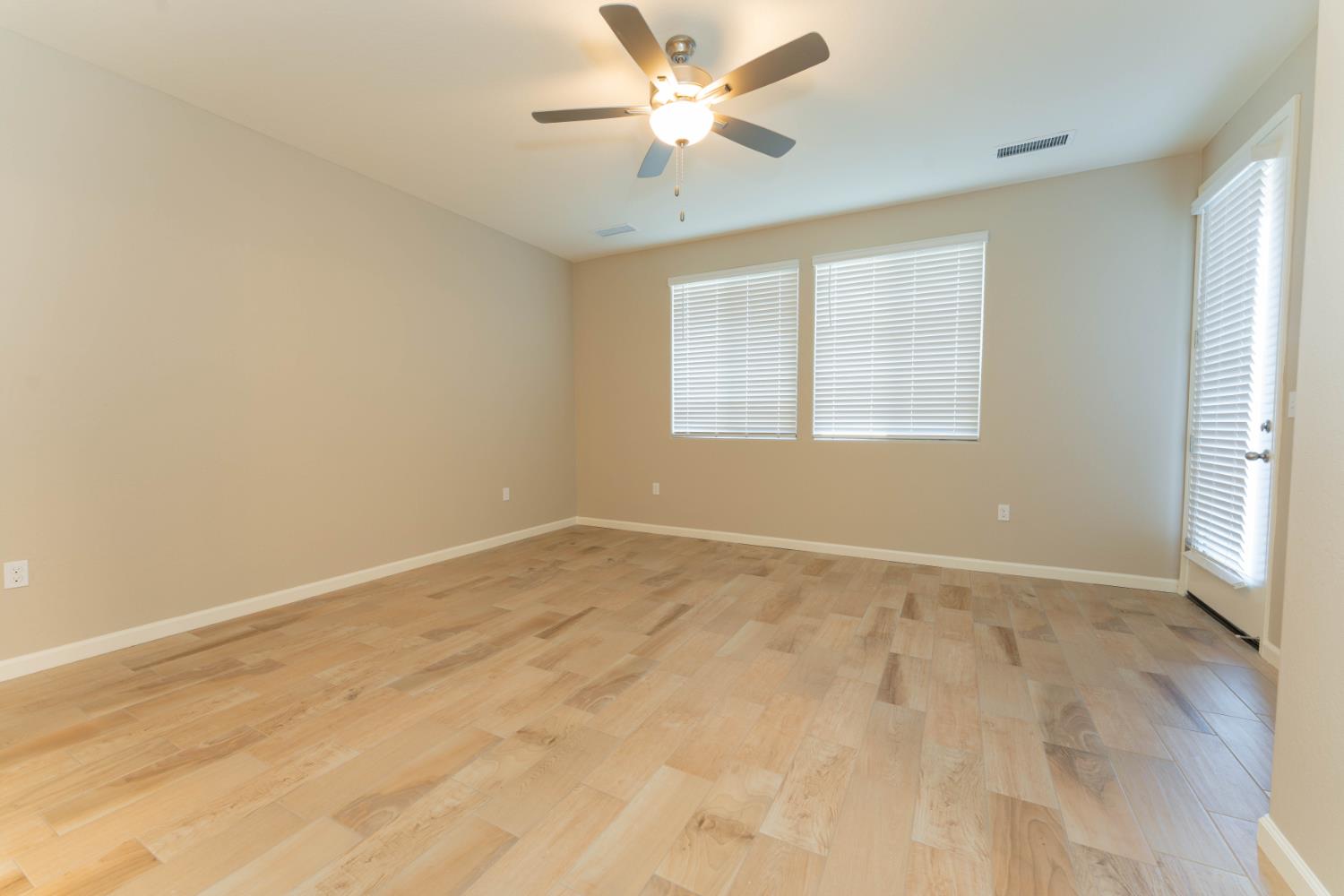 30480 Bellwood Road Visalia, CA 93291 - Photo 17 of 37 wooden floor in an empty room with a window