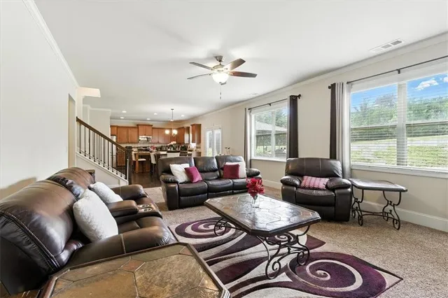 a kitchen with stainless steel appliances granite countertop sink stove microwave and cabinets