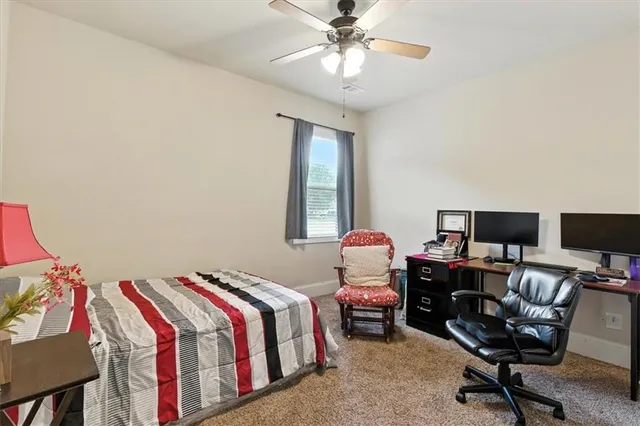 a bedroom with furniture and a window