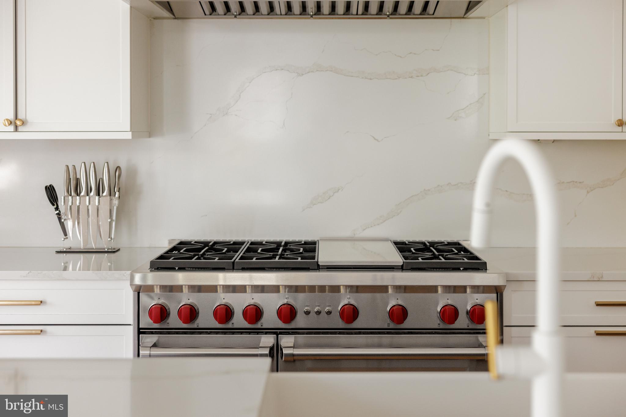 7208 Ridgewood Avenue Chevy Chase, MD 20815 - Photo 13 of 50 a white stove top oven sitting inside of a kitchen