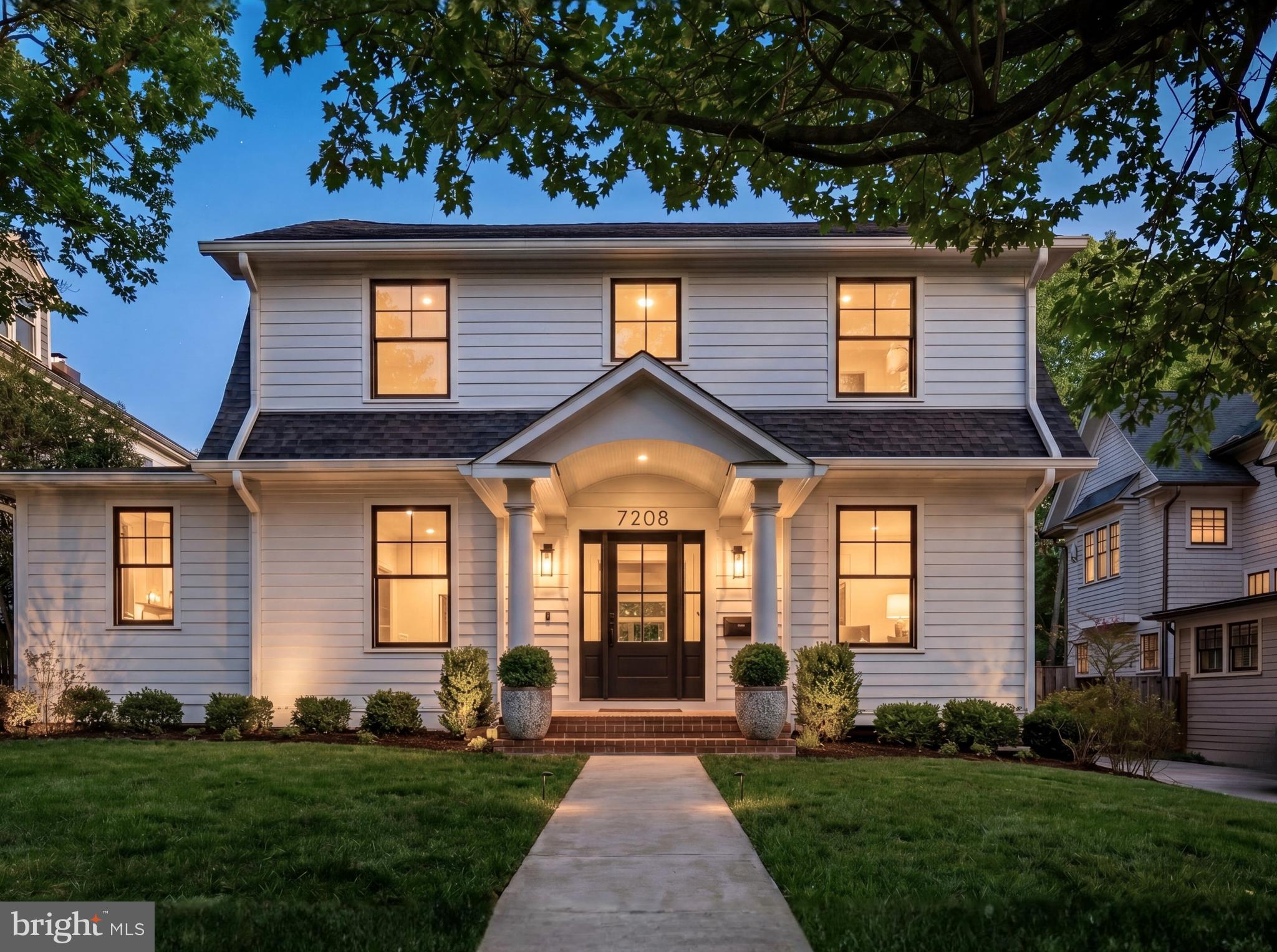 7208 Ridgewood Avenue Chevy Chase, MD 20815 - Photo 2 of 50 a front view of a house with a yard