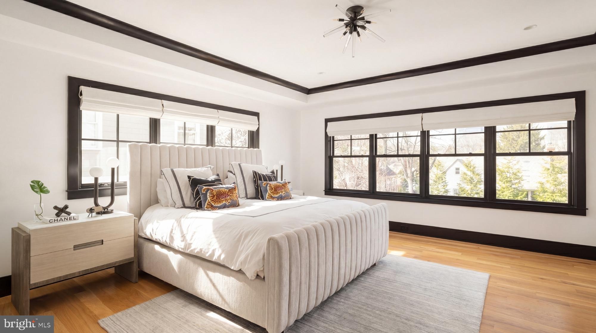 7208 Ridgewood Avenue Chevy Chase, MD 20815 - Photo 28 of 50 a bedroom with a large bed and a large window