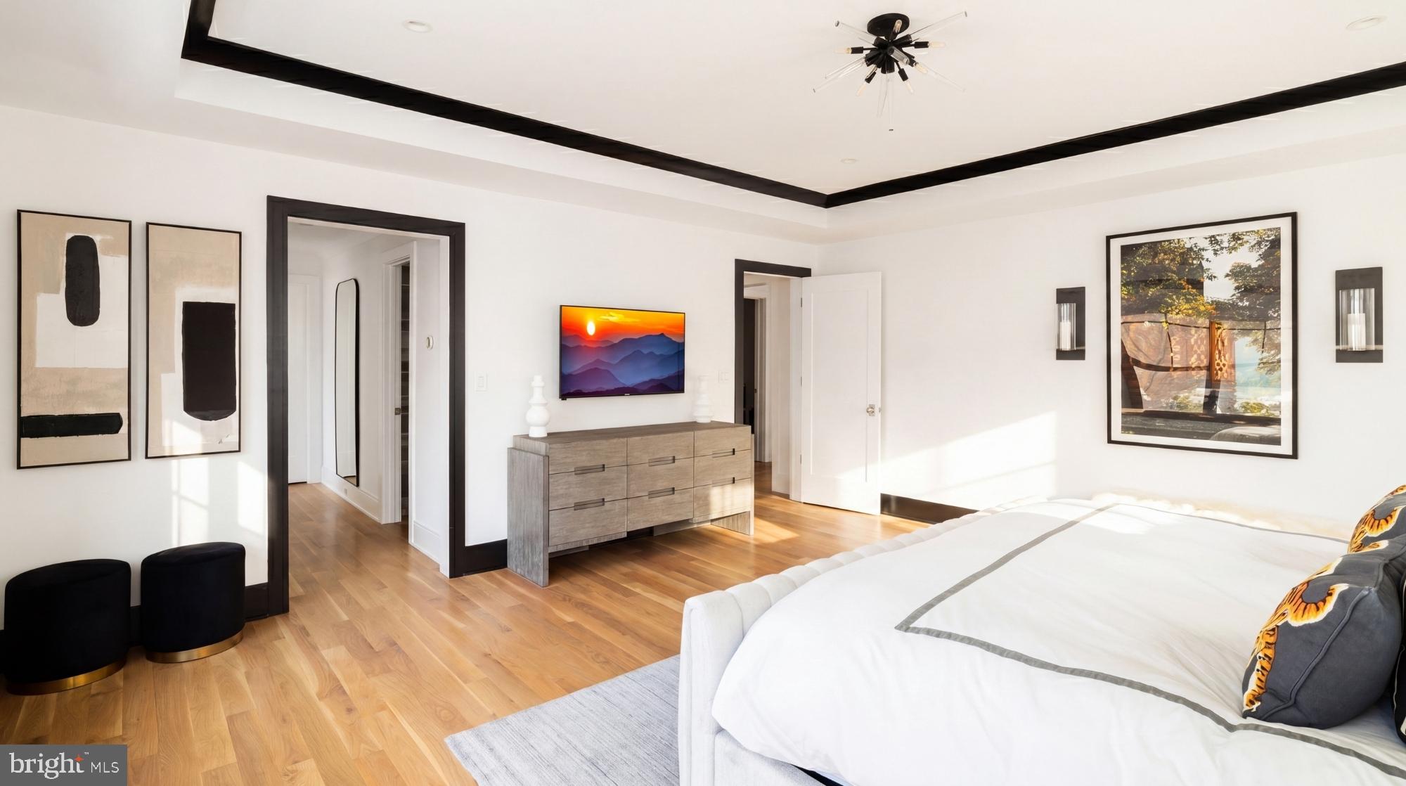 7208 Ridgewood Avenue Chevy Chase, MD 20815 - Photo 29 of 50 a bedroom with a bed and a flat tv screen