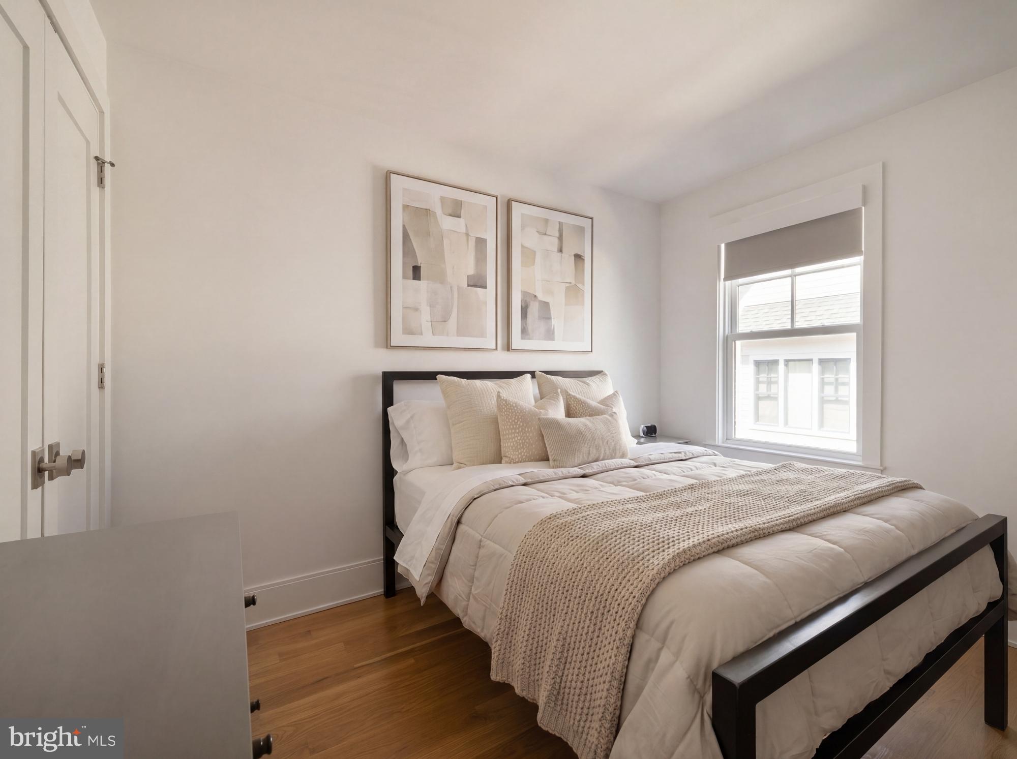 7208 Ridgewood Avenue Chevy Chase, MD 20815 - Photo 36 of 50 a bedroom with a bed and a window