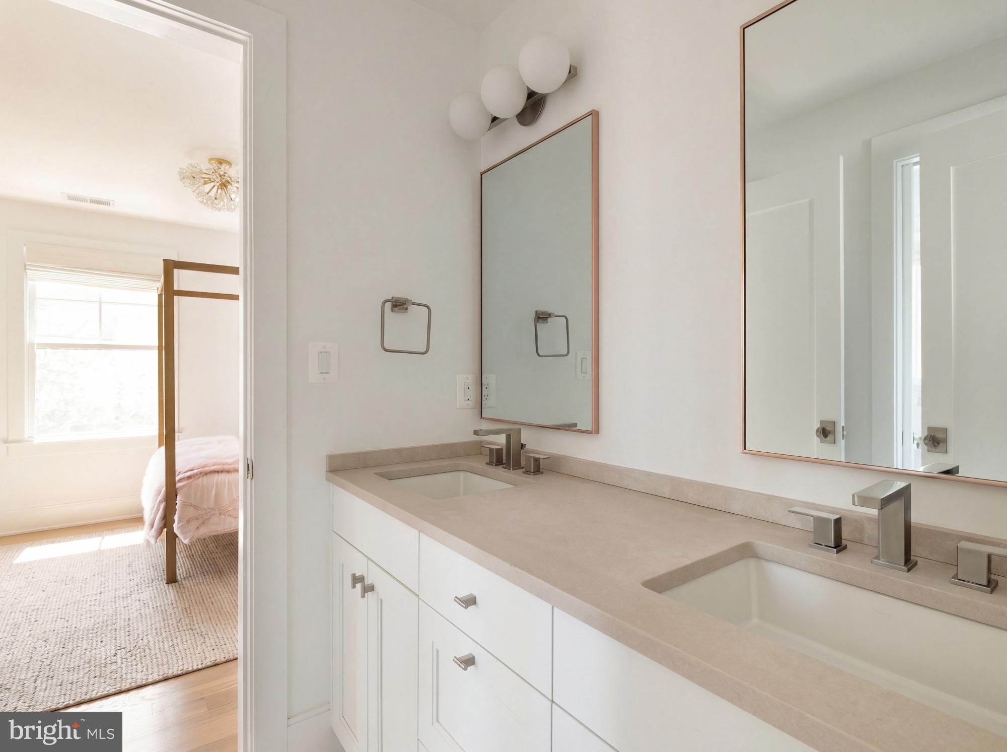 7208 Ridgewood Avenue Chevy Chase, MD 20815 - Photo 38 of 50 a bathroom with a sink and a mirror