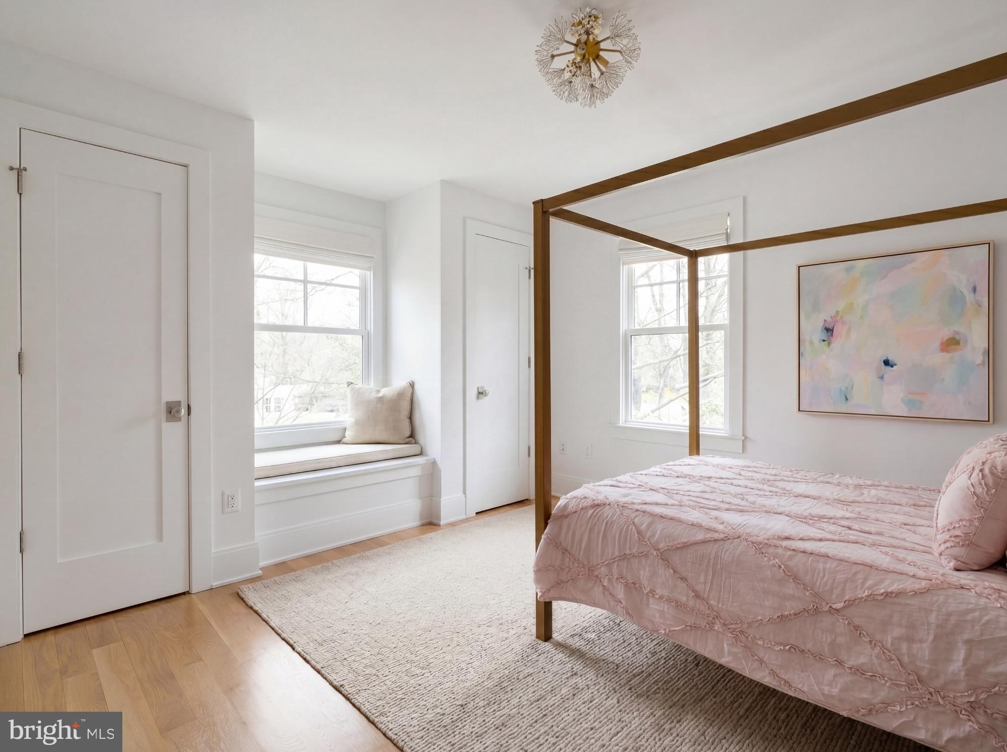 7208 Ridgewood Avenue Chevy Chase, MD 20815 - Photo 39 of 50 a spacious bedroom with a bed and a window