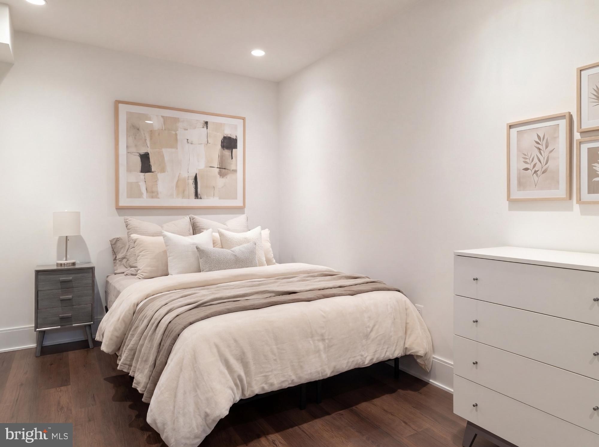7208 Ridgewood Avenue Chevy Chase, MD 20815 - Photo 45 of 50 a bedroom with a bed and painting on the wall
