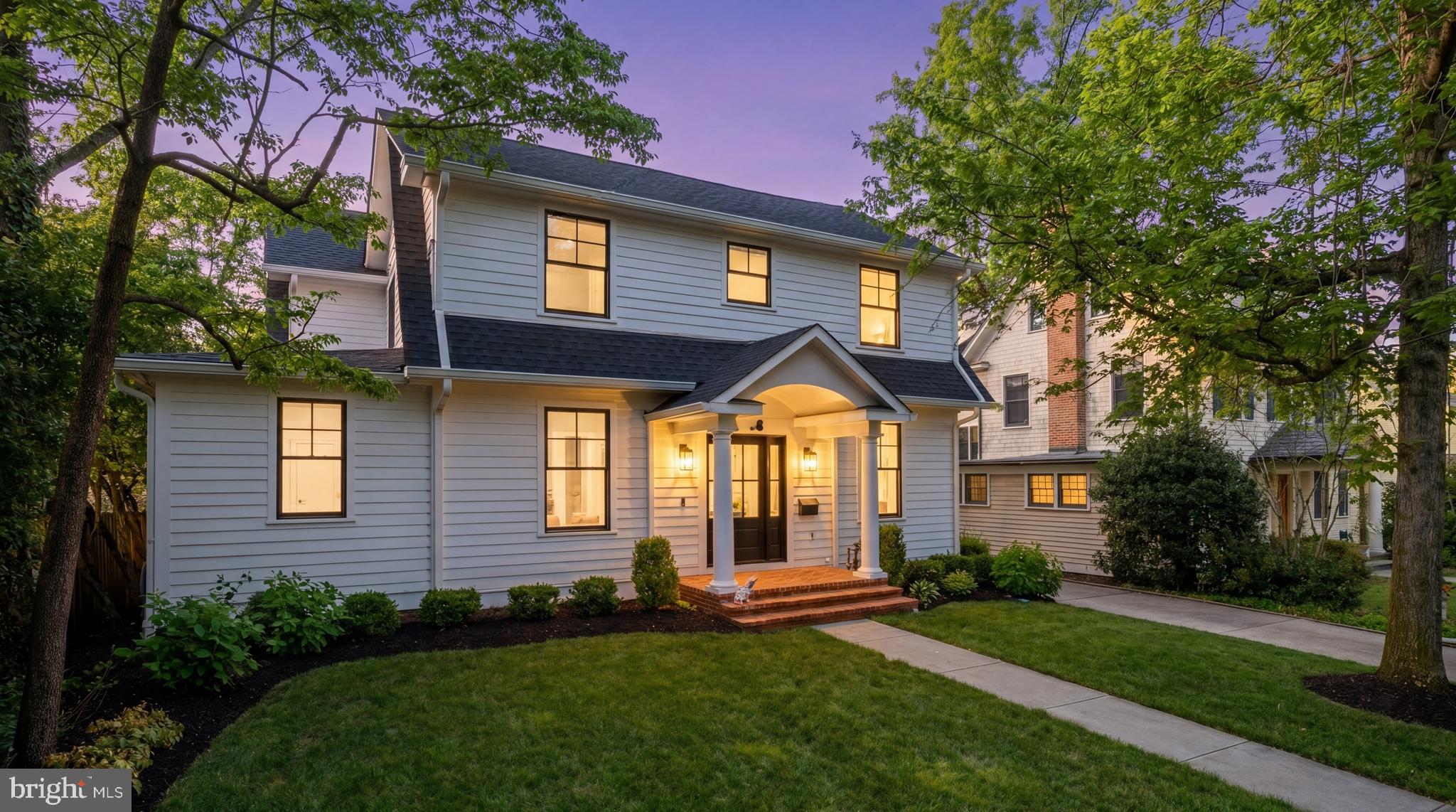7208 Ridgewood Avenue Chevy Chase, MD 20815 - Photo 50 of 50 a front view of a house with a yard