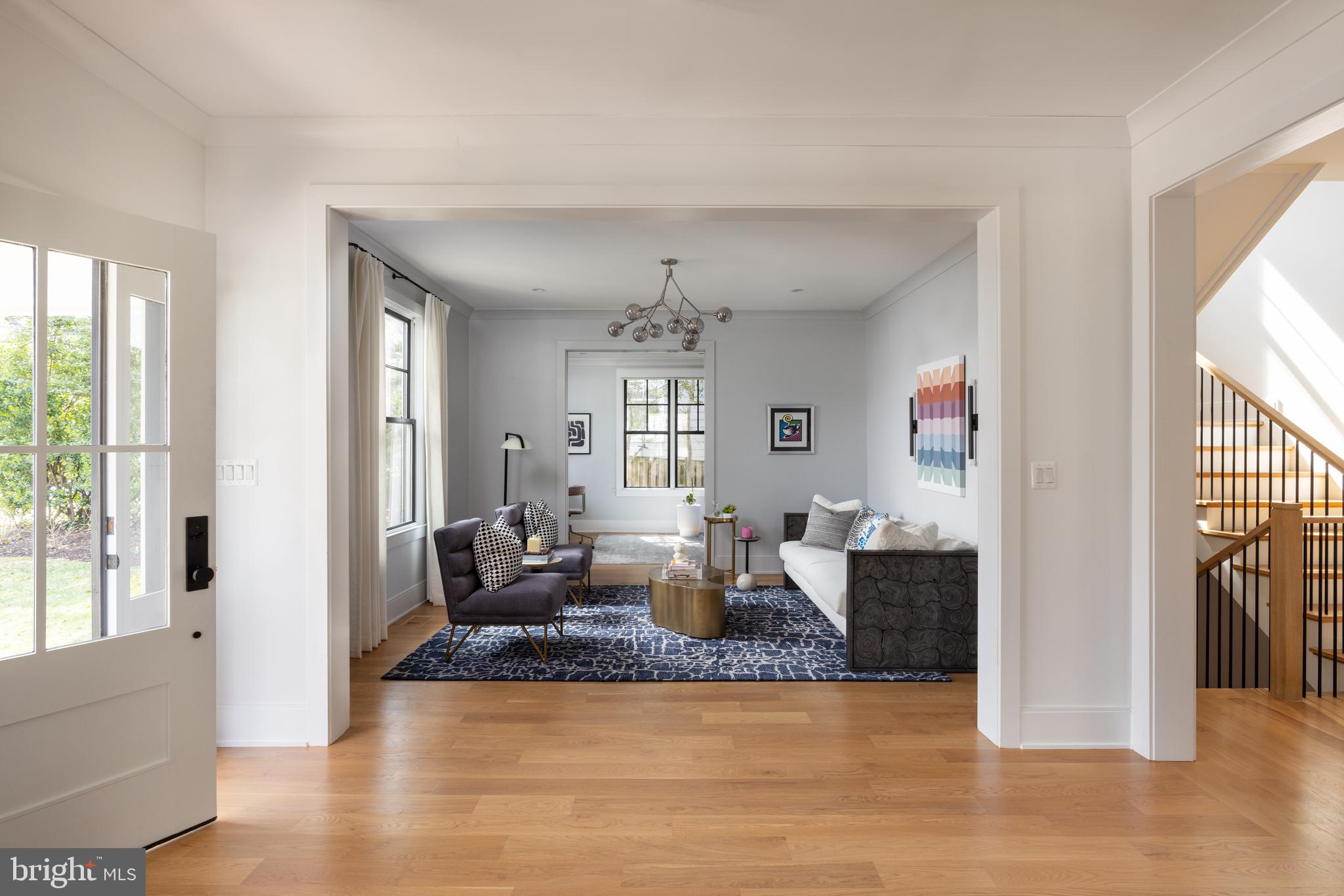 7208 Ridgewood Avenue Chevy Chase, MD 20815 - Photo 5 of 50 a living room with fireplace furniture and a large window