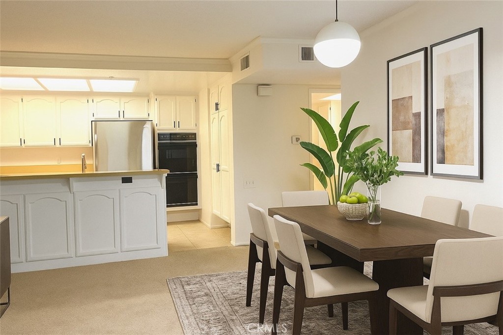 13601 Del Monte Drive, Unit 75 Seal Beach, CA 90740 - Photo 13 of 28 a dining room with furniture and window