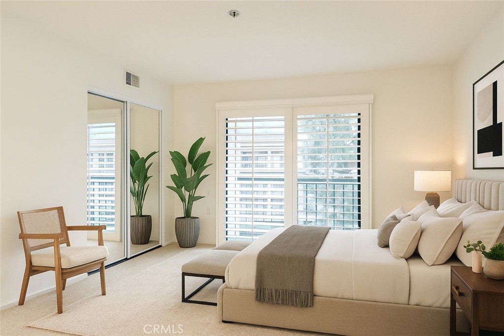 13601 Del Monte Drive, Unit 75 Seal Beach, CA 90740 - Photo 14 of 28 a bedroom with a bed and a couch