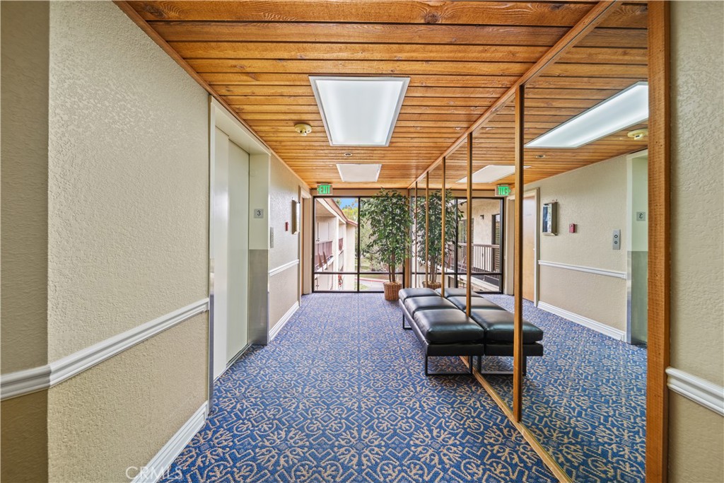 13601 Del Monte Drive, Unit 75 Seal Beach, CA 90740 - Photo 2 of 28 a living room with furniture and a window