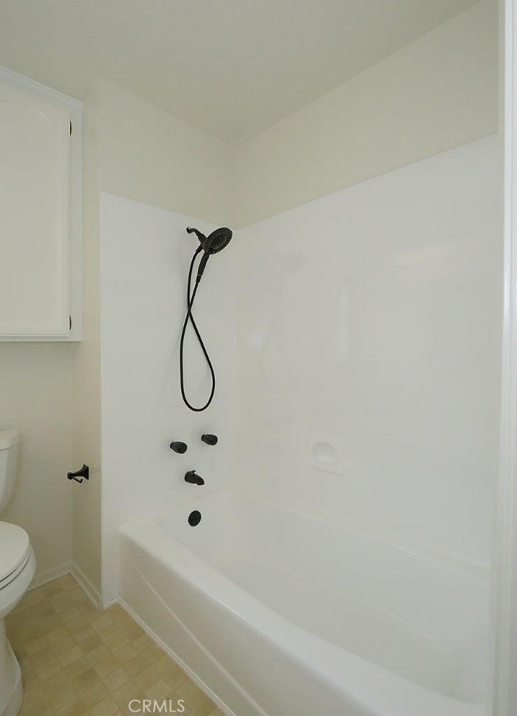 13601 Del Monte Drive, Unit 75 Seal Beach, CA 90740 - Photo 21 of 28 a bathroom with a bath tub and a shower