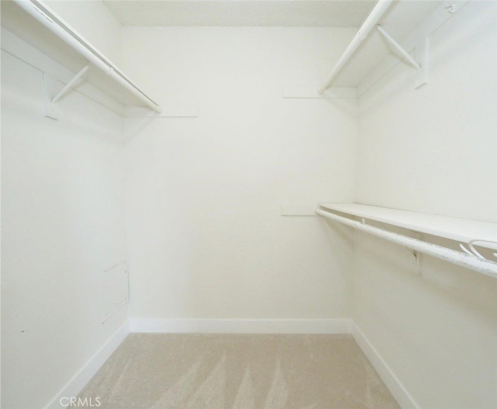 13601 Del Monte Drive, Unit 75 Seal Beach, CA 90740 - Photo 23 of 28 a view of small space with racks on the wall