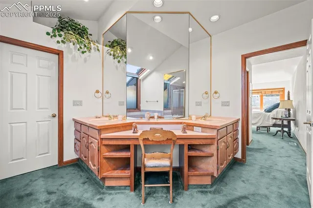 a dining room with a table chairs and a kitchen view