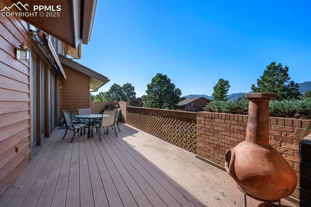 a view of balcony with furniture and wooden floor