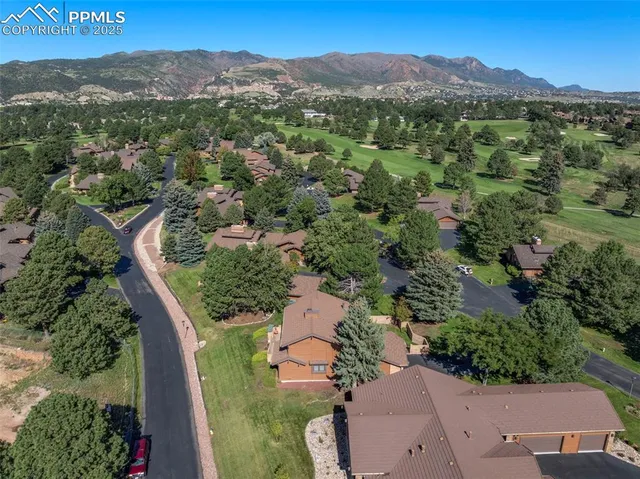 an aerial view of a house with mountain view