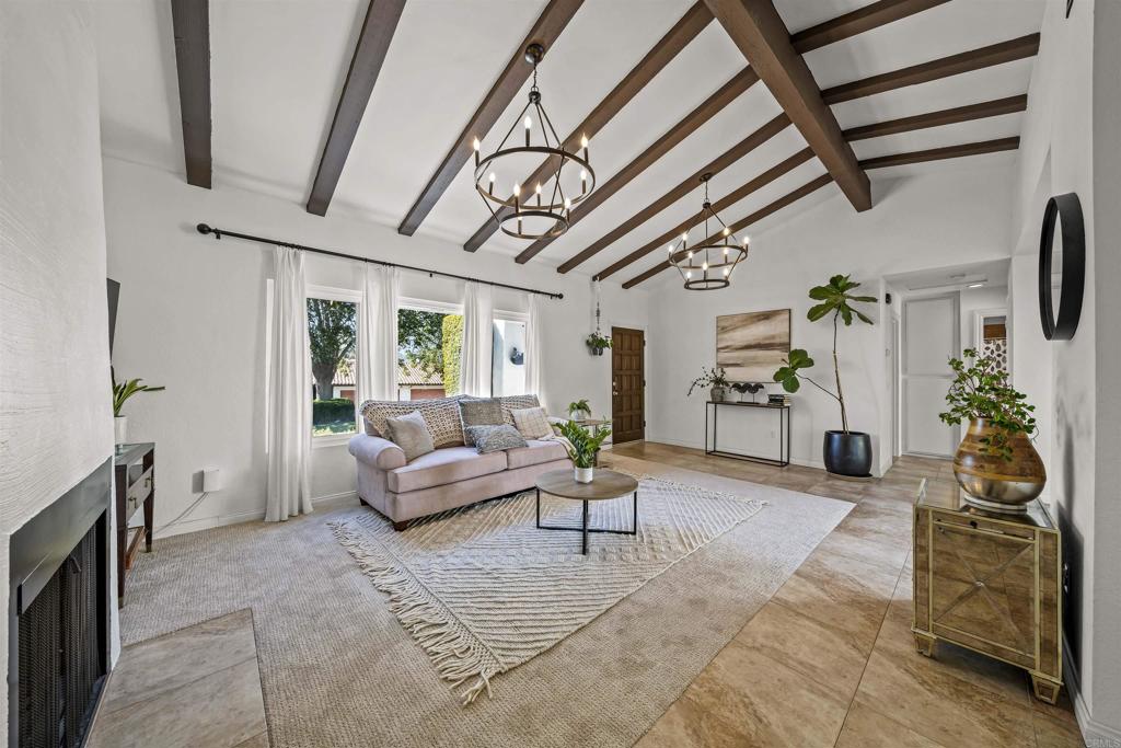 1237 La Paloma Glen Escondido, CA 92026 - Photo 14 of 43 a living room with furniture and a chandelier