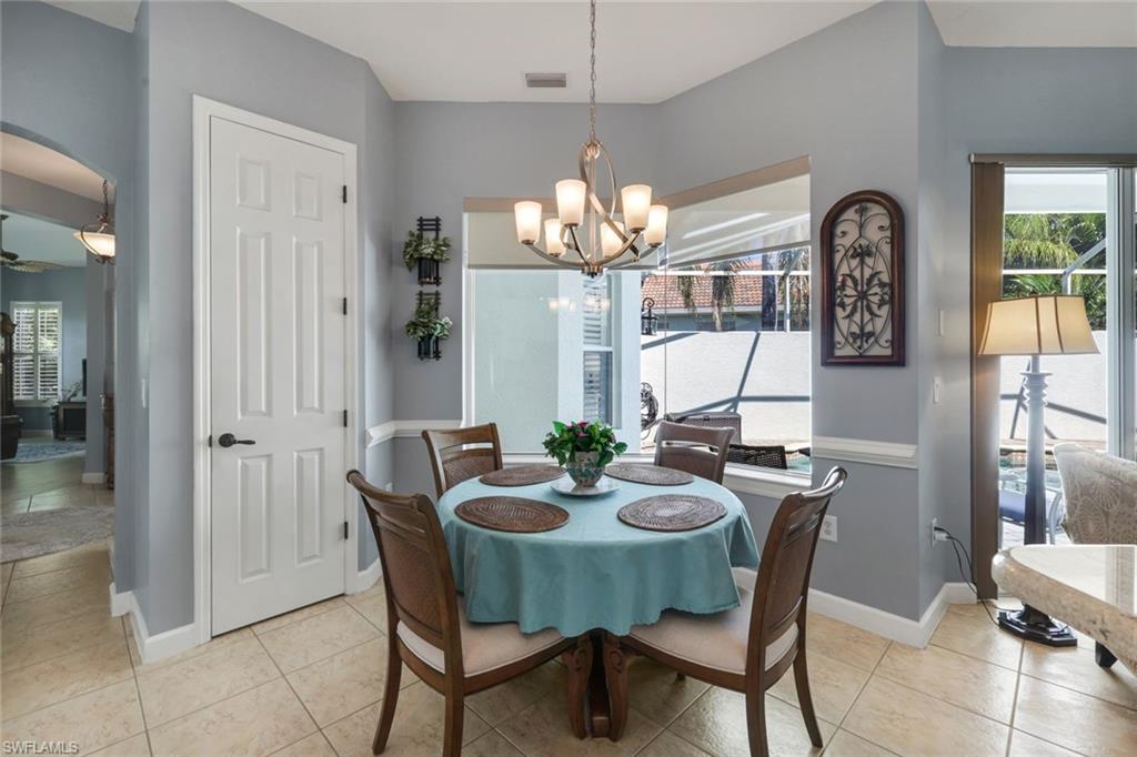 3232 Sundance Circle Naples, FL 34109 - Photo 15 of 50 a view of a dining room with furniture