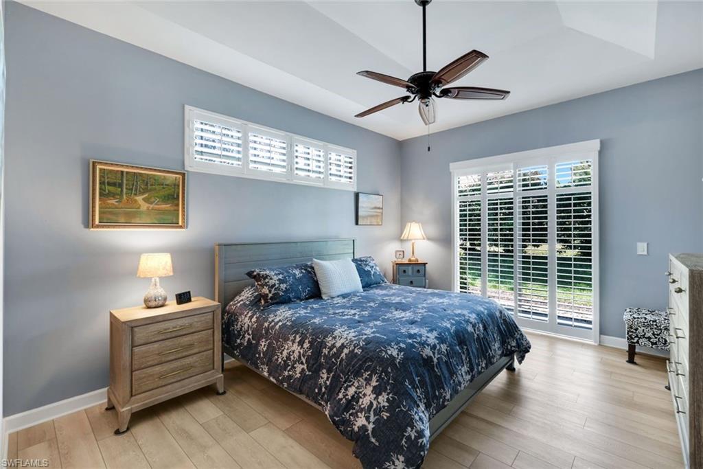 3232 Sundance Circle Naples, FL 34109 - Photo 17 of 50 a bedroom with a bed and a window