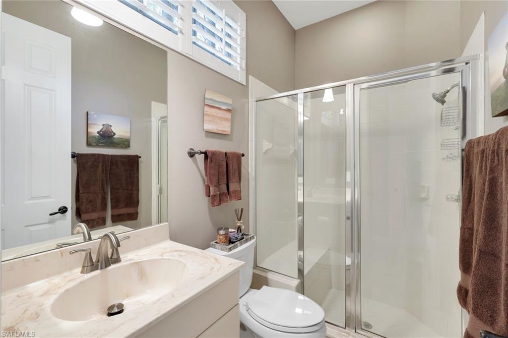 3232 Sundance Circle Naples, FL 34109 - Photo 22 of 50 a bathroom with a sink toilet and shower