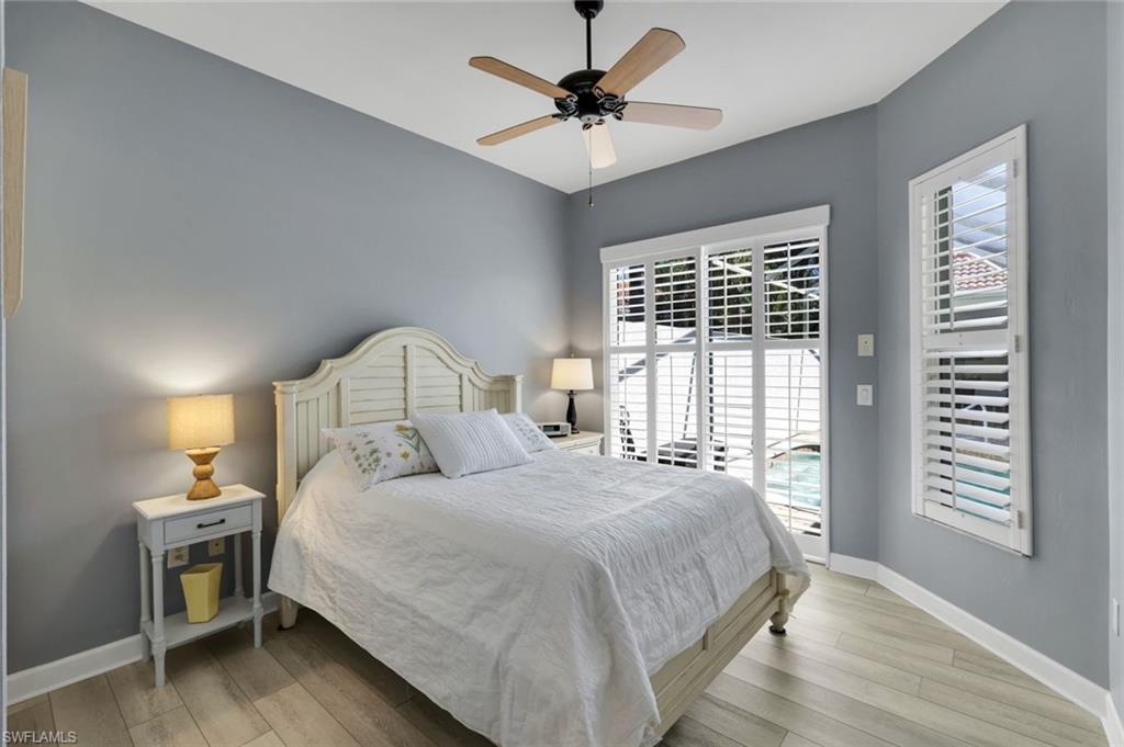 3232 Sundance Circle Naples, FL 34109 - Photo 23 of 50 a bedroom with a bed and a window
