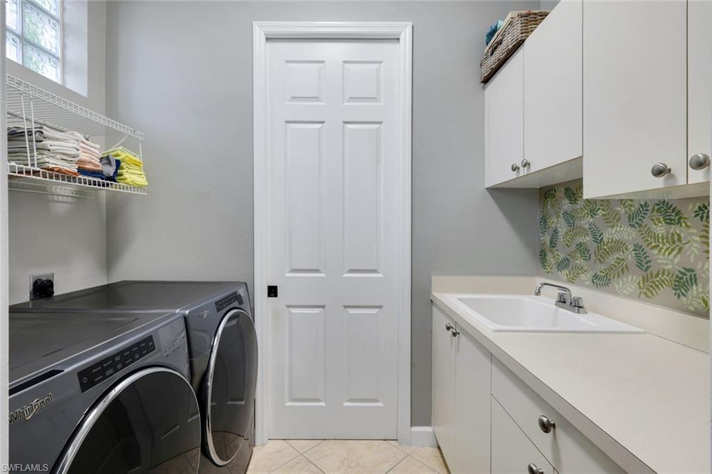 3232 Sundance Circle Naples, FL 34109 - Photo 25 of 50 a utility room with dryer and washer